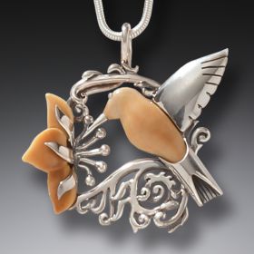 Fossilized ivory and silver hummingbird pendant